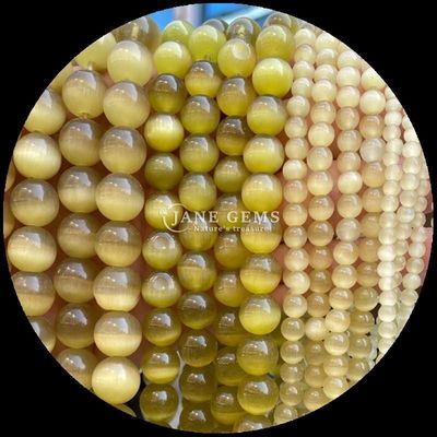 কমলা বেগুনি হলুদ রঙিন গোলাকার আকৃতির বিড়ালের চোখ লস মণির স্ট্র্যান্ড মণির আকার 4 মিমি / 6 মিমি / 8 মিমি / 10 মিমি / 12 মিমি