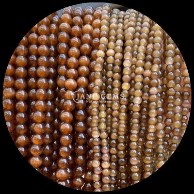 লাল নীল বেগুনি রঙিন মণির বৃত্তাকার আকৃতি বিড়ালের চোখ নিরাময় শক্তি এবং উপহার দেওয়ার জন্য আলগা মণির স্ট্র্যান্ড